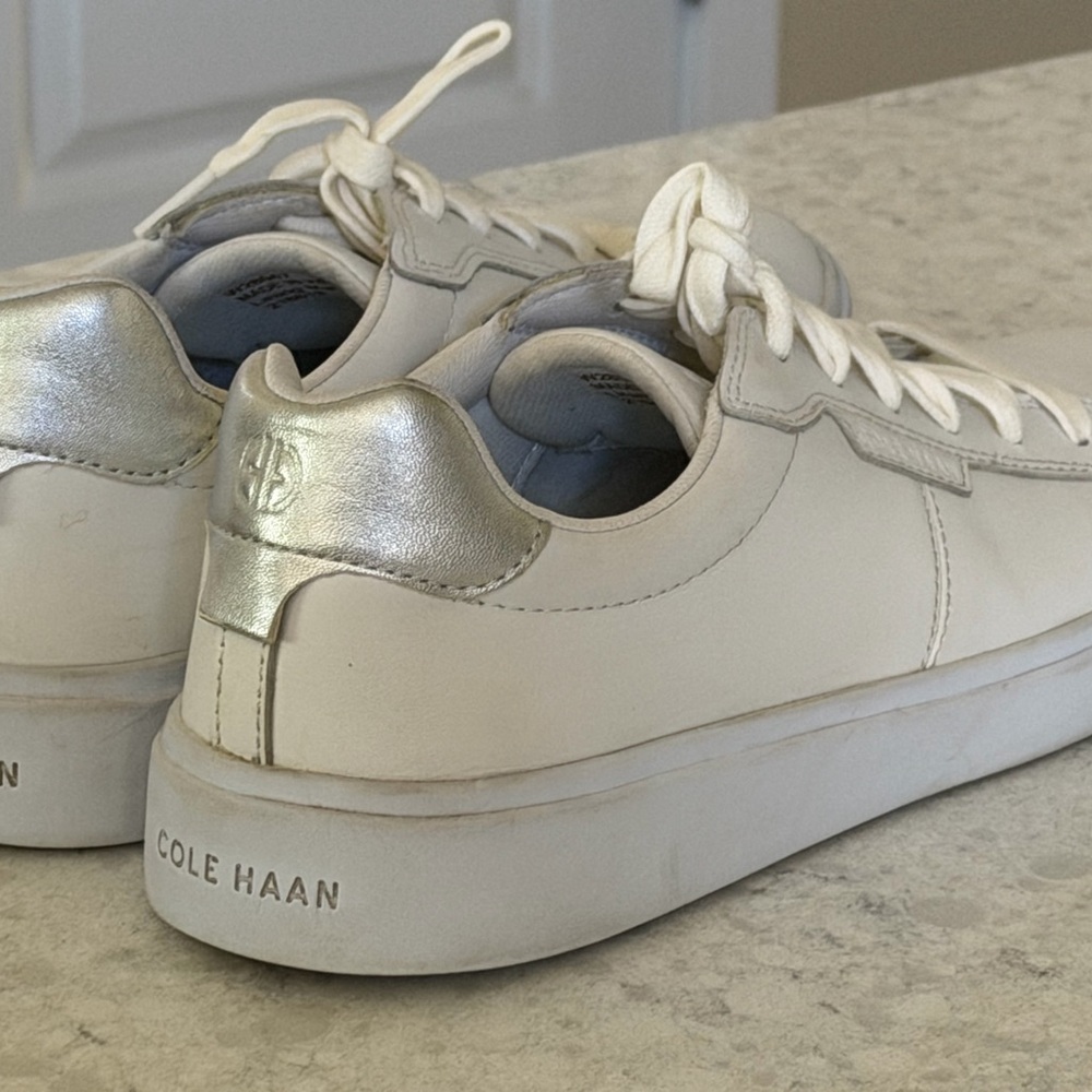 Cole Haan White women’s Sneakers w/  Gray accent. Size 9.5. Lace up. Leather EUC